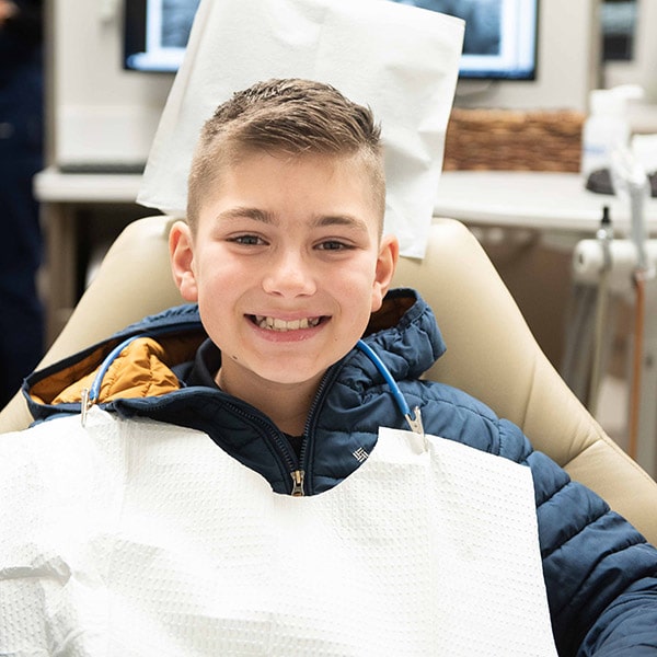 A happy child after receiving family dentistry services.